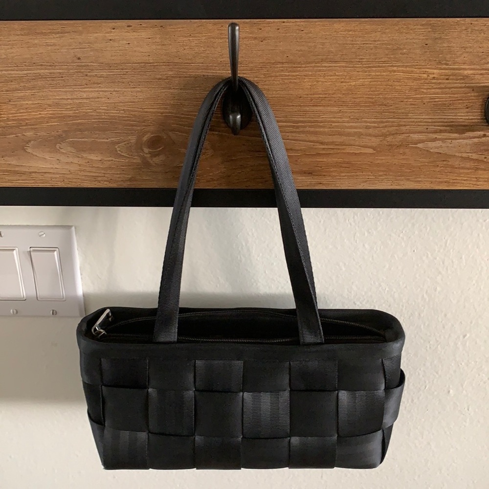 Black baguette Harvey’s seatbelt handbag